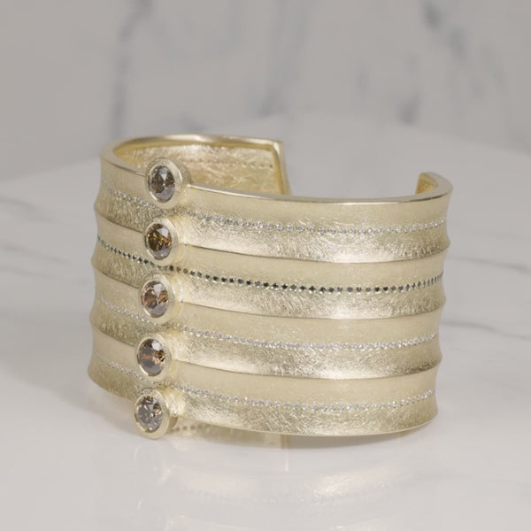 Todd Reed cuff bracelet made with Autumn™ diamonds (~5.03ct), white brilliant cut diamonds (~1.51ct), black brilliant cut diamonds (~.6ct), and 18k yellow gold.
