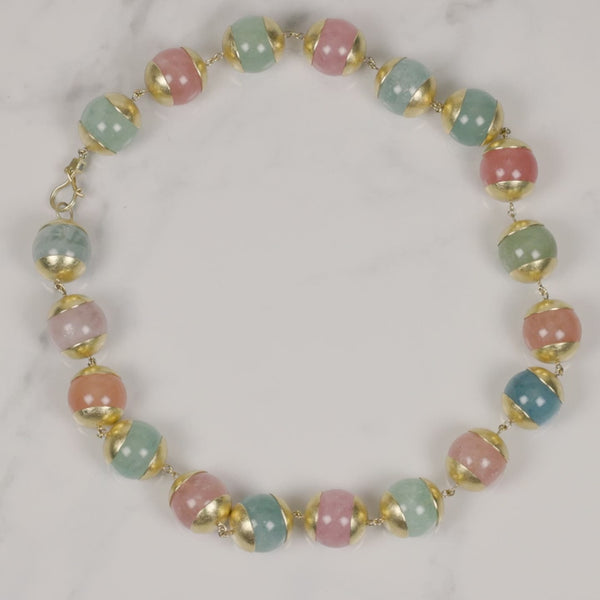 Todd Reed necklace made with 18k yellow gold and pastel colored baryl beads
