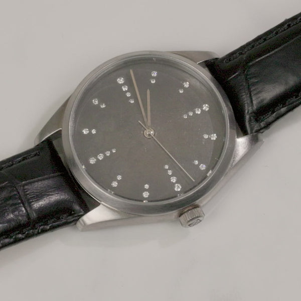 Todd Reed watch made with Stainless steel, sterling silver, and white brilliant cut diamonds (.24ct) on a leather strap