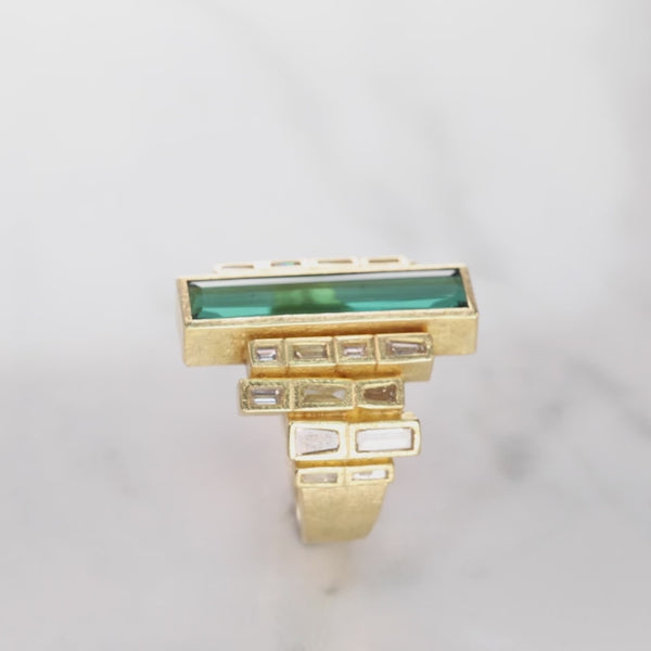 Todd Reed ring made with Tourmaline (4.10ct) white baguettes (~.41ct), cognac baguettes (~.76ct), and 18k yellow gold